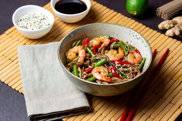 Soba noodles with shrimp, pepper and green beans. Japanese cuisine. Asian food.