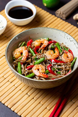 Soba noodles with shrimp, pepper and green beans. Japanese cuisine. Asian food.