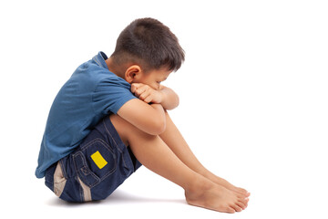  sad boy sittign on white background
