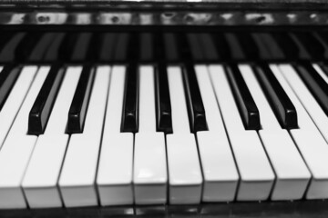 Piano keys closeup. Musical instrument in black and white photo.
