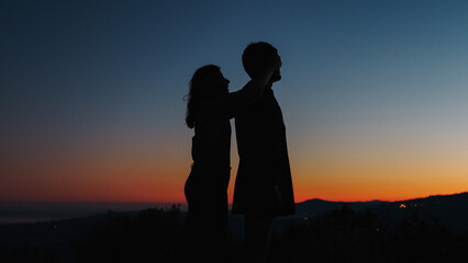 Silhouette of boy and girl surprise each other for Valentine's Day