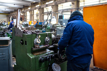 worker operating a machine, The Maintenance looking of working at industrial machinery and check...