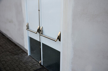 rear door of department store or warehouse with handle for quick release of door. evacuation door...
