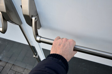 rear door of department store or warehouse with handle for quick release of door. evacuation door...