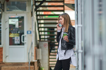 Girl with phone and coffee