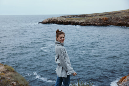 portrait of a woman sweaters cloudy sea admiring nature female relaxing