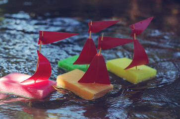 Sailboats made of kitchen sponges. Children's homemade ships sai
