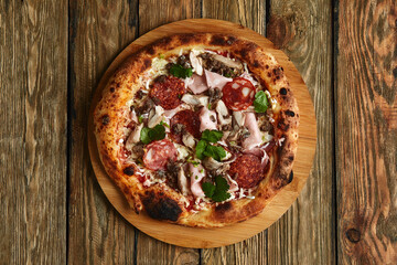 Meat Italian pizza with roast beef, steak slices, melted cheese, with olive slices and cheddar cheese. Close up, macro. Pizza time concept.