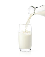 Pouring fresh milk into the glass isolated on white background. - obrazy, fototapety, plakaty