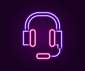 Glowing neon line Headphones with microphone icon isolated on black background. Colorful outline concept. Vector