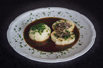 cooking at home and ready to eat, greaves dumpling in brown sauce from a roasted venison and chives
