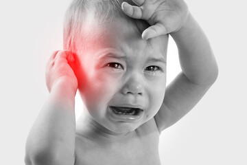 Crying baby suffering from a ear pain