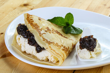 Pancake with cottage cheese and jam