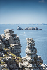Scenic view of rocky cliff on sea