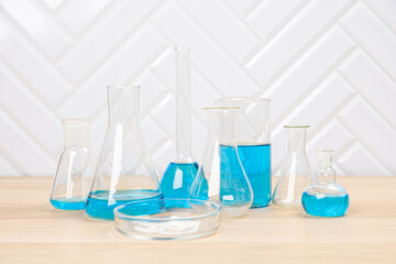 Laboratory glassware with test tubes. flasks, dropper, petri dishes, measuring cups and cylinders for scientific laboratories, laboratory equipment and analysis