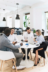 Multi-ethnic business people during meeting in modern office
