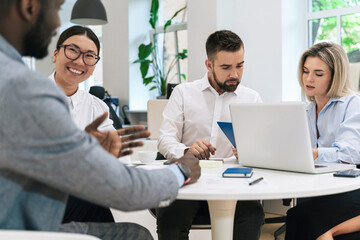 Multi-ethnic business people during meeting in modern office