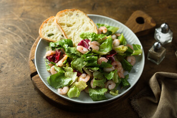 Healthy green salad with shrimps