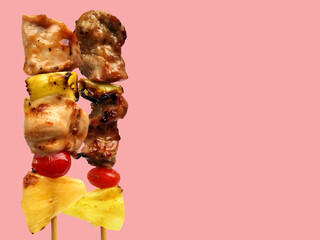 Thai street food fried skewer of pork and sauce with vegetables isolated on pastel color background and copy space for text concept for article and website and menu.