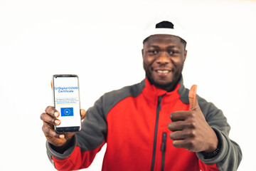 happy black man thumb-up covid certificate white background - portrait shot. High-quality photo