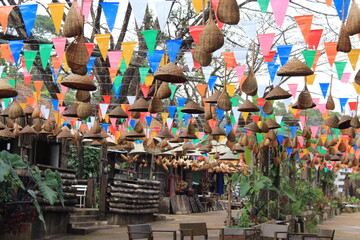 Decorated items made of color paper and bamboo utensils in various forms.