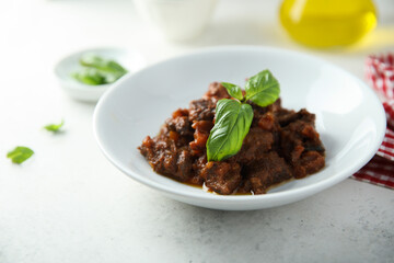 Homemade beef ragout with fresh basil