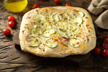 Homemade pizza with courgette and red onion