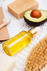 yellow cosmetic oil in bottle with pipette, eco-friendly organic natural skin care products