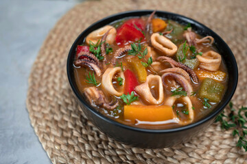 Stewed squid rings in tomato sauce for dinner