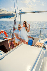 Happy Young couple have romantic walk on the yacht and relaxing. Weekend at sea. Travel concept.
