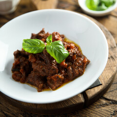 Homemade beef ragout with fresh basil