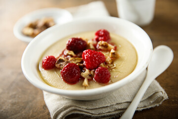 Homemade semolina pudding with raspberry and nuts