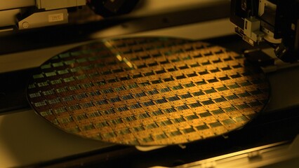 Silicon Wafer in Yellow light at Advanced Semiconductor Foundry, that produces Computer Chips. - obrazy, fototapety, plakaty