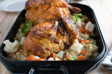 Healthy family meal with roasted chicken, brown rice and vegetable