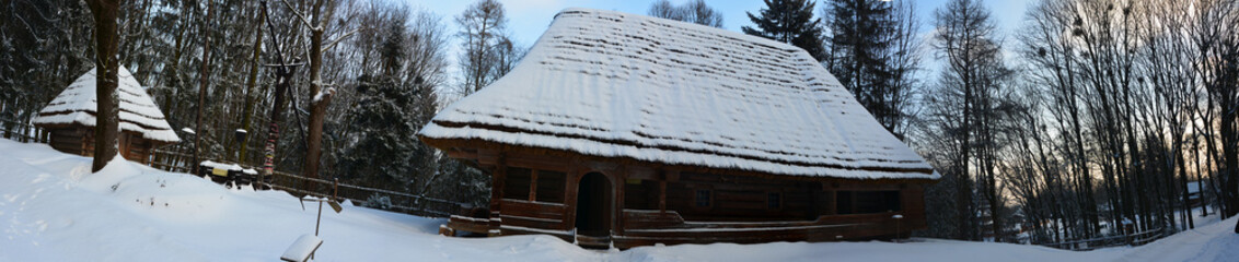 old snow-covered Ukrainian house in winter.Museum in Lviv Shevchenko guy.