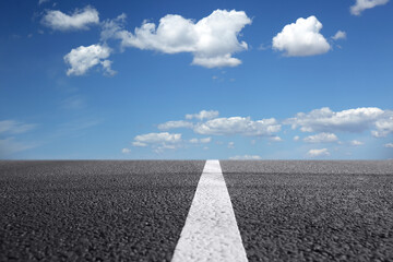View of empty asphalt road on sunny day