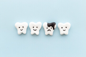 Teeth models with caries or plaque on gums. Oral health concept