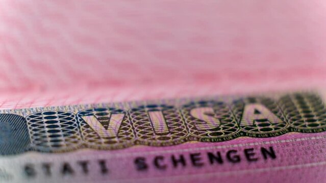 Macro shot biometric passport with schengen visa. European visitor visa for tourism and travel in EU