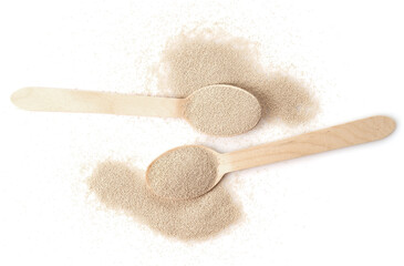 Dry yeast in wooden scoop isolated on white background