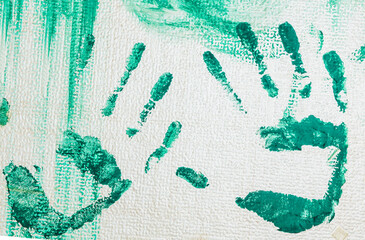 Hand prints smeared with paint