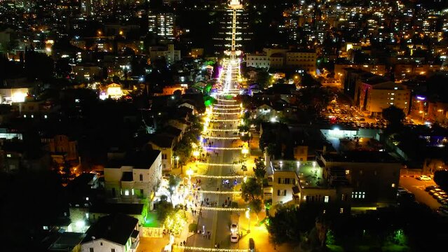 Aerial time lapse of people and cars in downtown Haifa at night, Israel