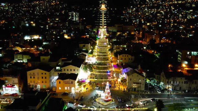 Aerial view of cars and pedestriands at night in Haifa city,  tourist destination
