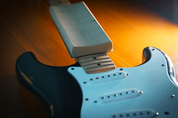 black electric guitar maintenance fret leveling