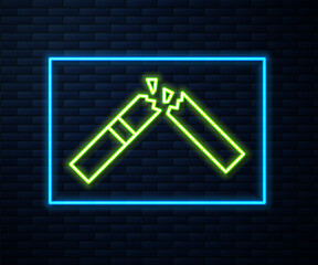 Glowing neon line Broken cigarette icon isolated on brick wall background. Tobacco sign. Smoking symbol. Vector