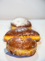 Donuts on fat thursday holiday as background or banner on front view.