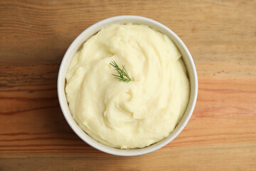 Freshly cooked homemade mashed potatoes on wooden table, top view