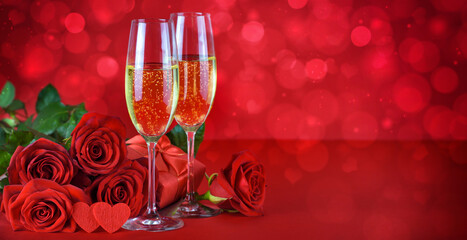 Romantic date night concept. Champagne, hearts, gift and roses on a festive red background.