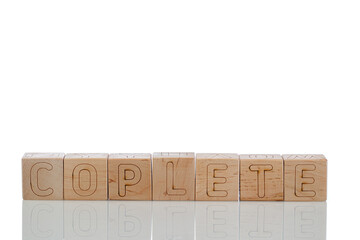 Wooden cubes with letters coplete on a white background