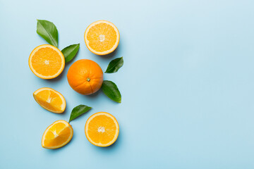 fresh Fruit orange slices on colored background. Top view. Copy Space. creative summer concept. Half of citrus in minimal flat lay with copy space