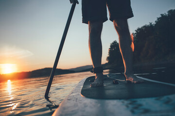 Paddleboarding, low angle view of man paddling sup board